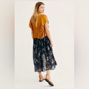 Free people Lydia skirt. Black and white floral with black solid under skirt.